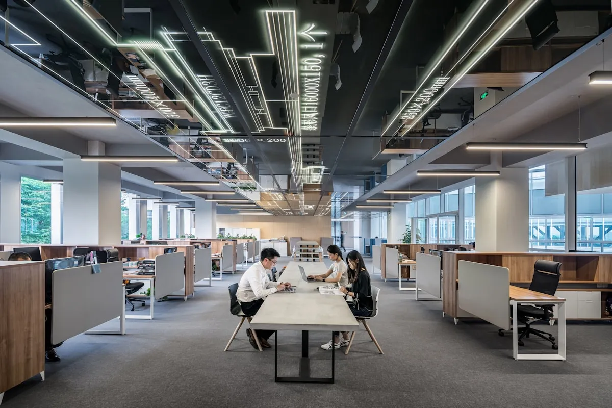 A neon lit open plan coworking floor